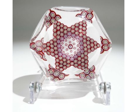A meticulously crafted French millefiori paperweight by Saint Louis, featuring a central Star of David motif in rich ruby red
