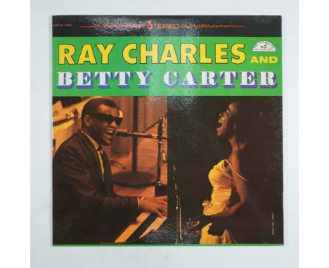 A remarkable collaboration between two iconic artists, this vintage vinyl LP features Ray Charles and Betty Carter, released 