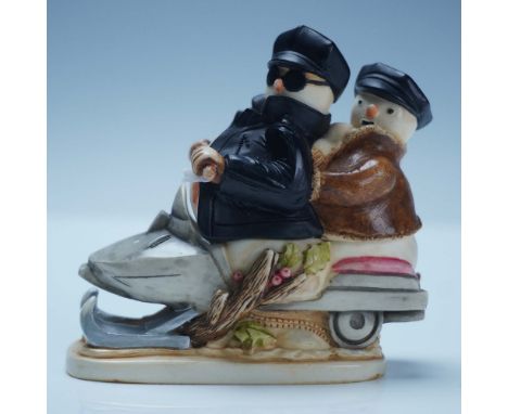 Crafted from a blend of crushed marble and resin. The figural box depicts a snowman couple dressed in winter motorcycle attir