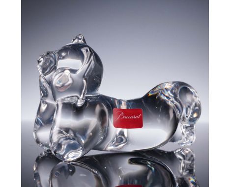 Adorable Baccarat crystal figurine depicting a teddy bear in a prone pose with rounded limbs and gentle facial features. Craf