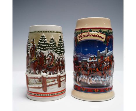 A set of two limited edition Budweiser holiday beer steins handcrafted for Anheuser-Busch. The first stein titled "Old Towne 