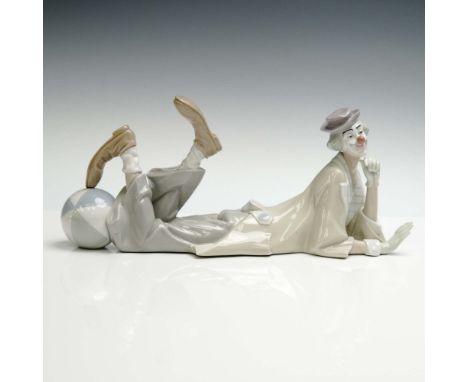 Playful Lladro porcelain figurine titled Clown with Ball, model number 1004618. This hand-painted glazed porcelain sculpture 