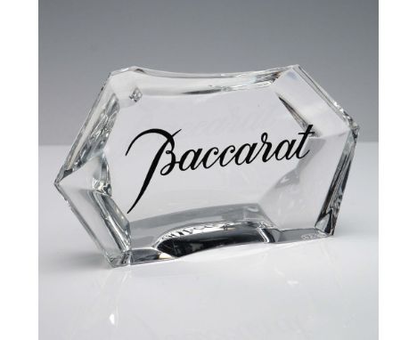 This Baccarat crystal display plaque features a faceted geometric form with a sloped top surface and polished edges. The fron