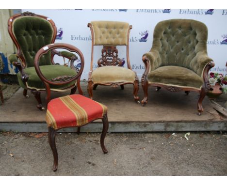 Victorian walnut button back lady's armchair, the carved spoon shape back with low open arms and carved cabriole legs, a simi