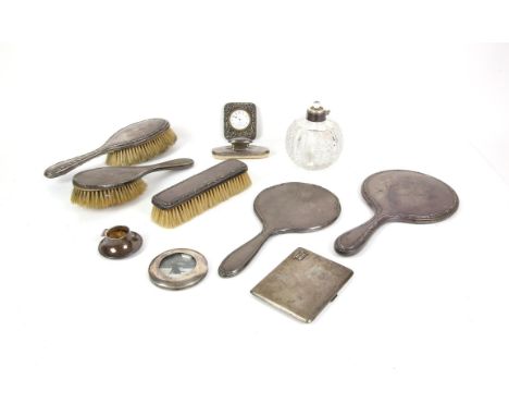 Silver backed three piece brush and mirror set, Birmingham 1921, another hand mirror, hair brush and nail buffer, grenade sha