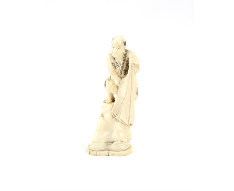 A Japanese Okimono , Meiji PeriodCarved Ivory representing a fisherman 13.1 X 5 cm, Comes with a Dutch certificate of authent