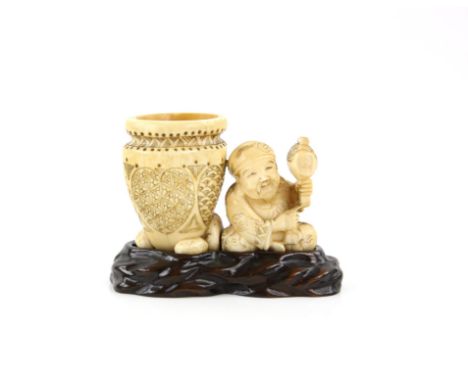 A Japanese Okimono , Meiji PeriodCarved Ivory representing a man with a pot . Wood stand 8.5 X 12 cm, comes with a Dutch cert