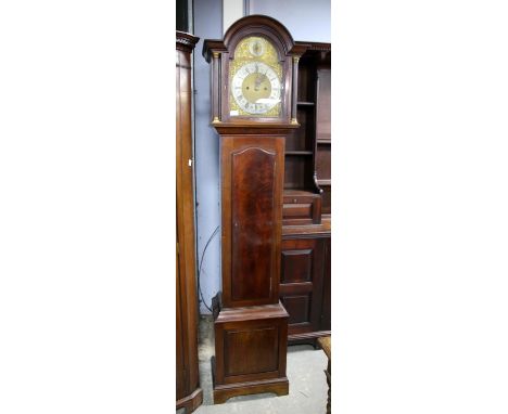 Early 20th century mahogany eight day longcase clock, the arched hood with fluted columns enclosing a brass dial with strike/