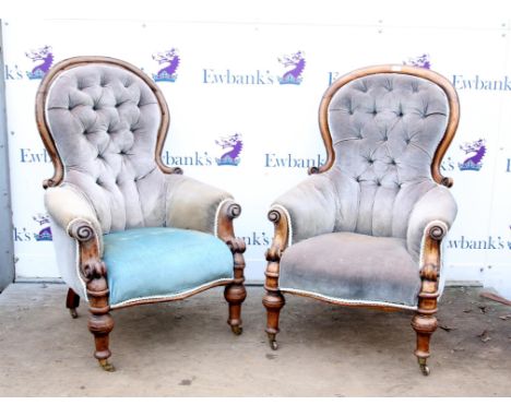 Pair of Victorian button back gentleman's armchairs, with arched backs, scroll arms, and turned legs on castors (2)