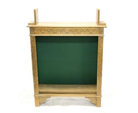 Late Victorian carved light oak open bookcase, the top with fixed bookends over a lunette carved frieze, adjustable shelves a