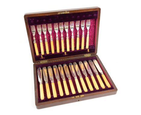 Cased set of twelve silver fish knives and forks, with ivory handles, London 1904, total weight 29 oz, (one fork missing) (23