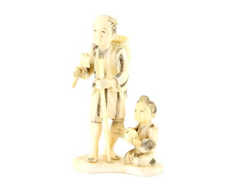A Japanese Okimono , Meiji Period Circa 1880 Carved Ivory representing a man playing with a boy boat. 10 X 6 cm, Comes with a