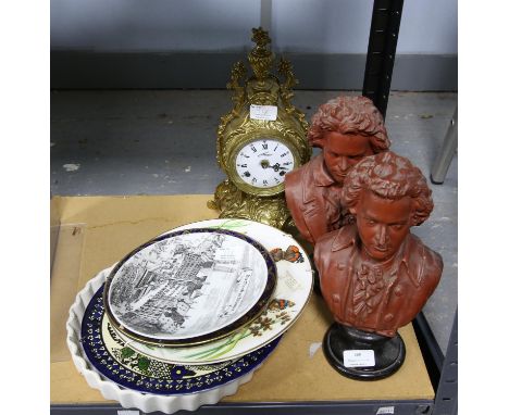 Pair of busts of Beethoven (height 29cm each), a gilt mantel clock, and a set of miscellaneous porcelain plates. 
