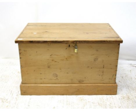 Pine trunk, of rectangular form with hinged lid, metal carry handles and plinth base, H57 W94 D59 cmCondition Report:  loose 