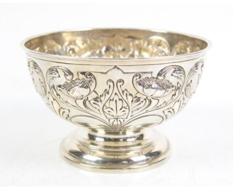 Silver repousse pedestal bowl, with lobed floral decoration, marks rubbed, partially removed engraving to a cartouche, H10.5 