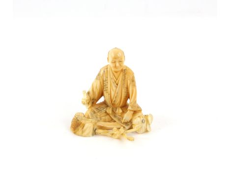 A Japanese Okimono , Meiji PeriodCarved Ivory representing a sitting man with an axe or hammer in his hand . Signed 7.1 X 7.1