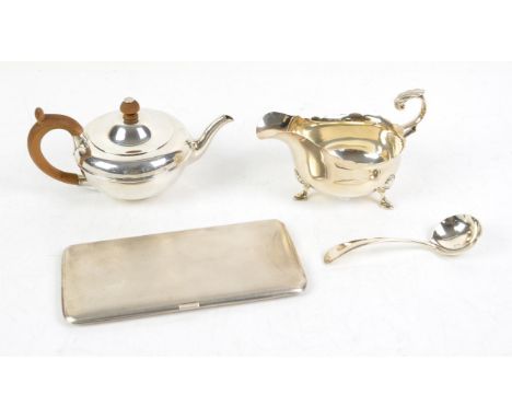 Silver miniature teapot, London 1921, 9 cm high, silver sauce boat and ladle and an engine turned cigarette case total weight