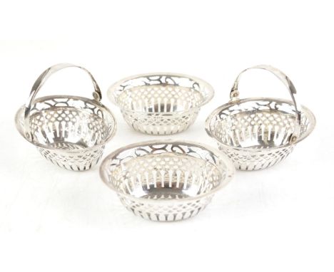 Pair of silver pierced swing handle baskets, 9.5 cm long, and another matching pair without handles, Birmingham 1911, total w