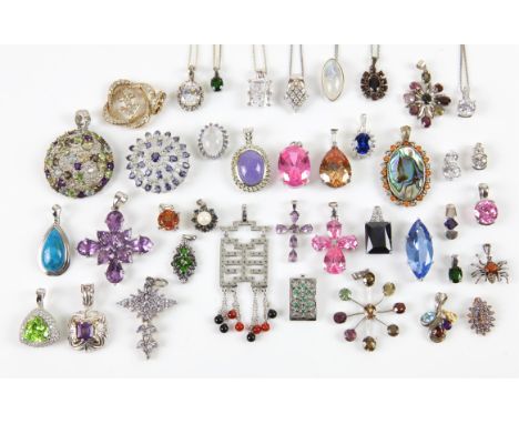 A group of forty one gem stone set or cz set pendants and eight fine silver chains, pendants include an oval cabochon cut moo