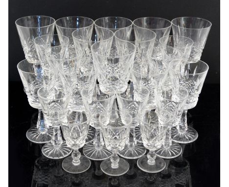 Set of eight Waterford Crystal red wine glasses, 17 cm high, another set of eight white wine glasses, four sherry glasses, an