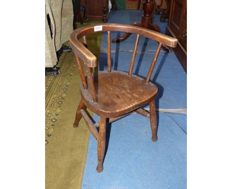 A vintage child's carver chair. 20 1/2'' high, 12'' high seat.