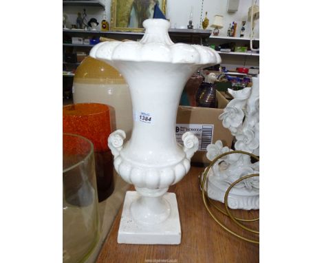 A white china lamp base with ram head handles, 17'' high, some wear.
