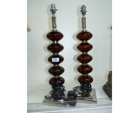 A pair of modern table Lamp bases with flattened sphere, tortoiseshell effect columns on square metal bases, 22" tall.