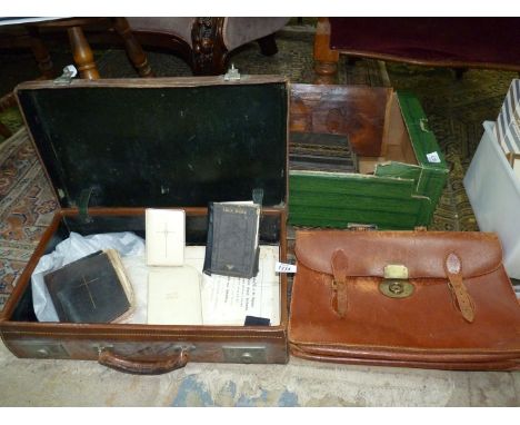 A vintage leather suitcase marked 'Rev. C.D.B Gale, leather briefcase and a small quantity of Holy bibles.