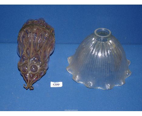 A metal caged pink glass Moroccan light shade and a large empire ribbed glass light shade.