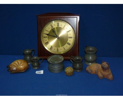 A Metamec quartz wall clock, pewter inkwell and four tankards, etc.