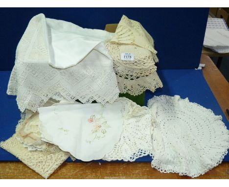A quantity of vintage linen including crocheted doilies, tablecloths, etc.