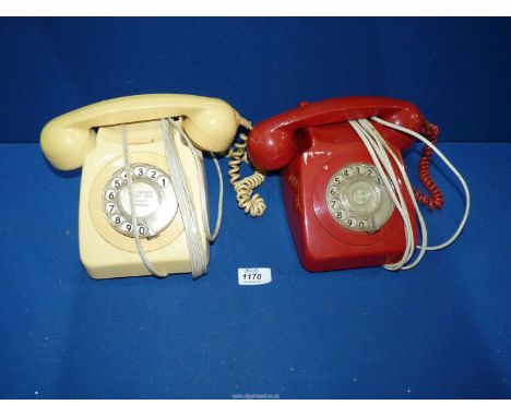 Two vintage rotary dial and corded Telephones, red and cream.