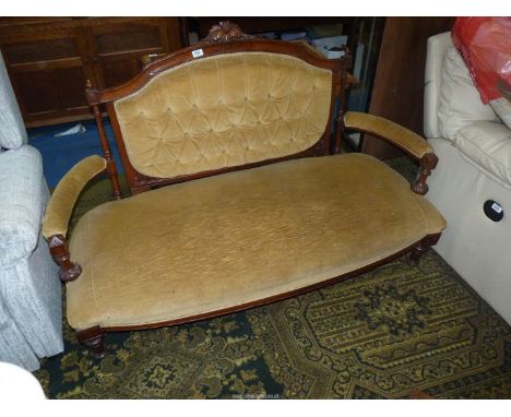 A most elegant Edwardian Mahogany/Satinwood framed two seater Sofa having swept arms, turned front legs and buttoned back, 60