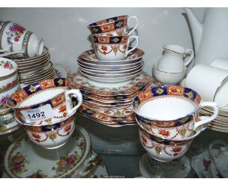 A vintage Royal Vale china tea set for six, including cups, saucers, tea plates and bread & butter plates.