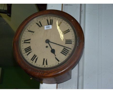 A Mahogany cased single fusee movement circular Wall clock having a cream face with Roman numerals, key and pendulum present.