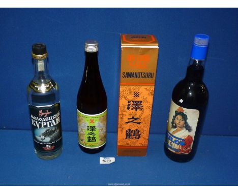 Three bottles of alcohol, 'Sawanotsurin' sake (boxed), 'Dulce, Espadafor, Vino Aromatizado' and 'Bogka' Russian vodka.