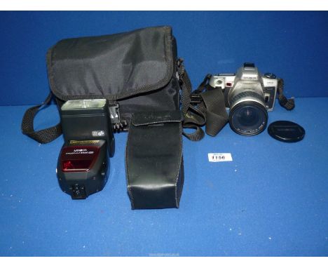 A Minolta camera, 505SI Super with AF200 zoom, flash and carrying case.