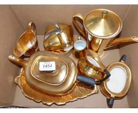 A mixture of gold china to include Grimwades Royal Winton creamer and leaf plate, Crown Devon teapot, sugar and creamer and M