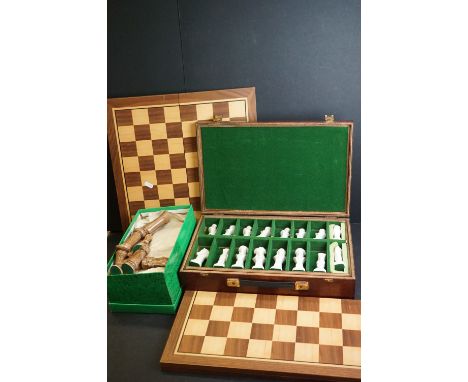 Two set of ceramic chess sets together with two wooden chess boards and a wooden bagatelle board. 