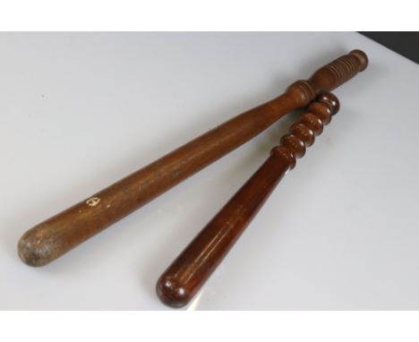 Two vintage wooden truncheons, to include military police 