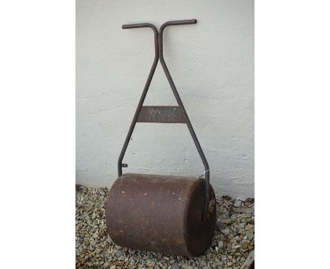 A vintage cast iron garden lawn roller. 