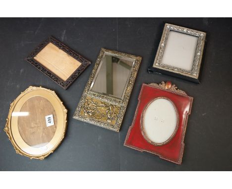 Vintage bevel edged mirror with brass plate surround embossed with Dutch figures (approx. 30cm x 16cm) together with four orn