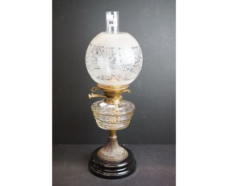 Late 19th / Early 20th century oil lamp with clear cut glass layered pattern font, brass base with black china foot, Messenge