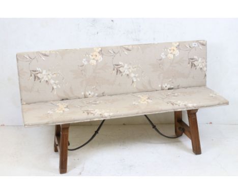 Mid century Folding Banquette / Hall Sofa with brown floral fabric upholstery raised on square wooden legs united by an iron 