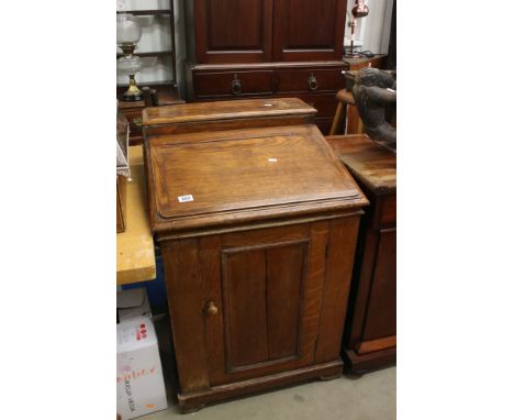 Victorian Oak Davenport, the sloping hinged lid opening to a later fitted White Ceramic Wash Basin with Brass Taps, cupboard 