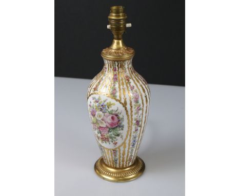 Porcelain and Gilt Metal Table Lamp in the Sevres manner hand painted with panels and rows of floral sprays and heightened in