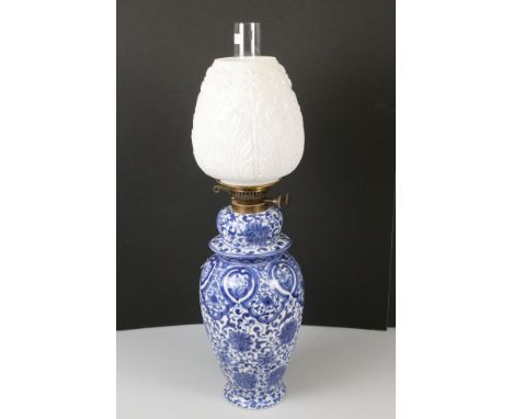 Kloster Veilsdorf blue and white china oil lamp with drop-in font and embossed white beehive-shaped shade, 66cm high 
