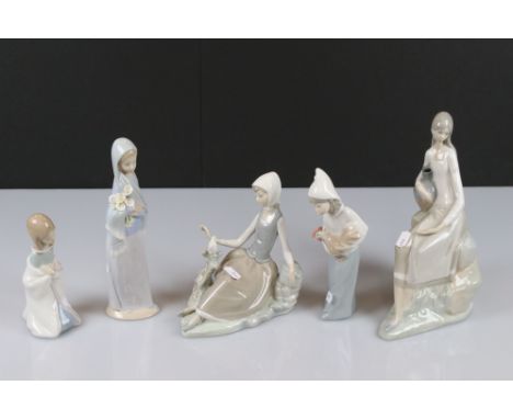 Four Lladro Figurine, tallest 23cm together with a Nao Figurine 25cm high 