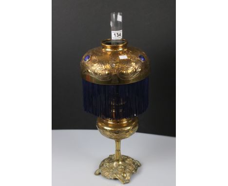 Late 19th / Early 20th century Oil Lamp of Art Nouveau form with ornate brass base, font, Kosmos Brenner burner and shade. Th