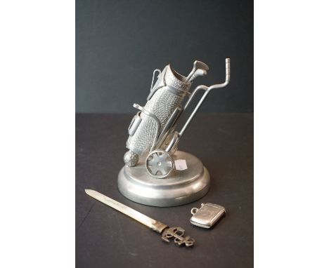 A small group of collectables to include a mother of pearl paperknife, a ornamental pewter golf caddy and a vesta case. 